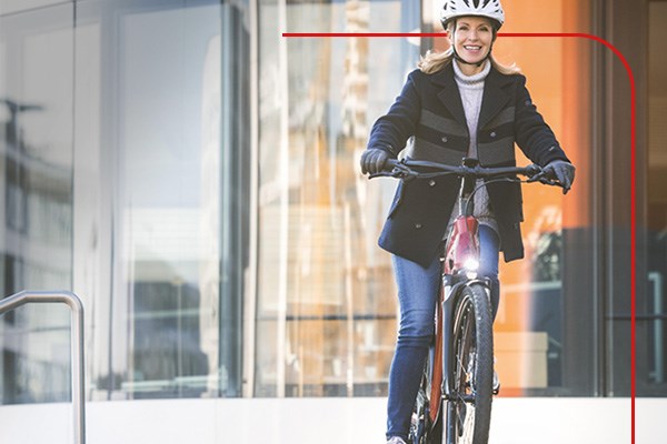 A cyclist commuting on an electric hybrid bike